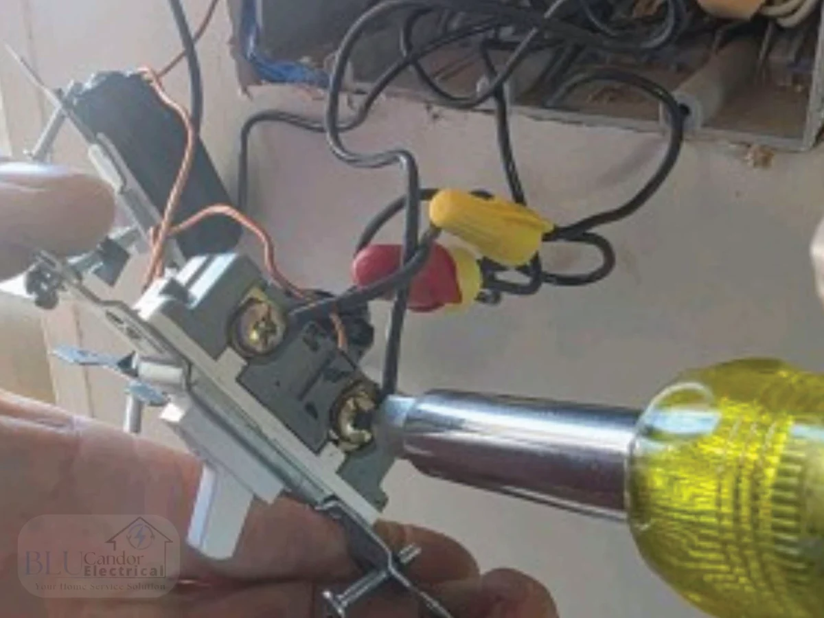 Licensed electrician installing residential light switch wiring in Northeast Texas